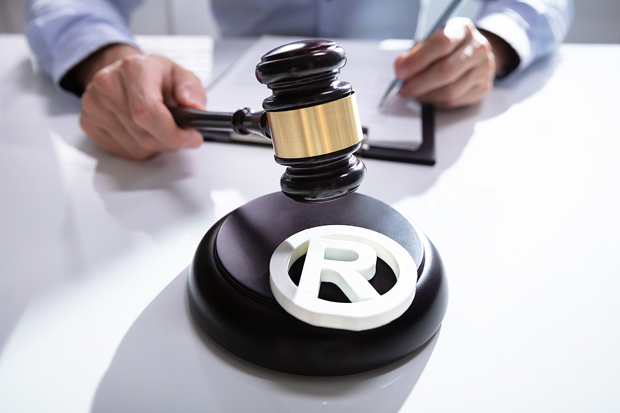 Lawyer, gavel and a trademark symbol