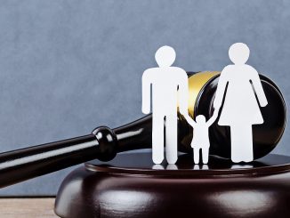 Gavel and a family figure. Family Law concept