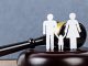 Gavel and a family figure. Family Law concept